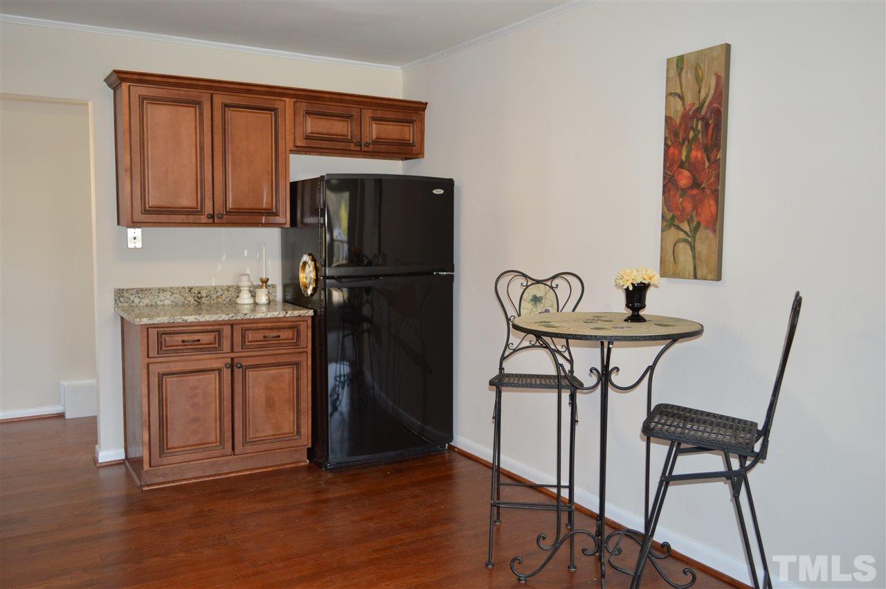 709 Friar Tuck Road Raleigh, NC 27610 - Photo 8 of 30 a kitchen with stainless steel appliances granite countertop a refrigerator and a stove top oven