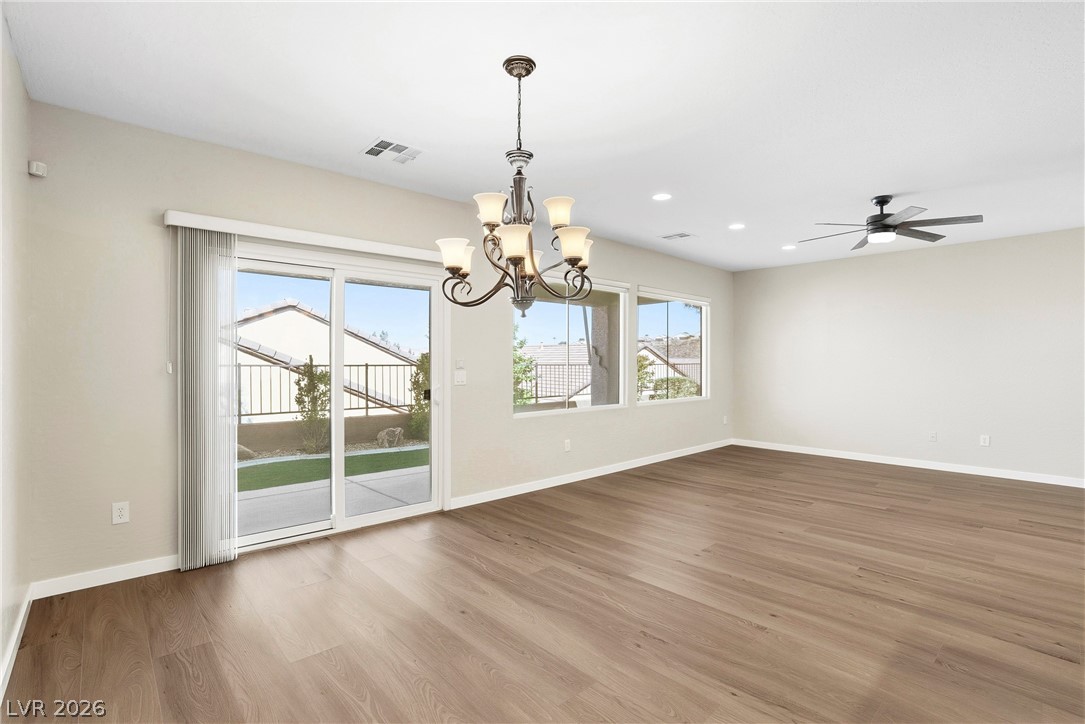 2541 Darda Street Henderson, NV 89044 - Photo 7 of 26 This expansive room features elegant flooring, ample natural light, and modern fixtures, perfect for entertaining.