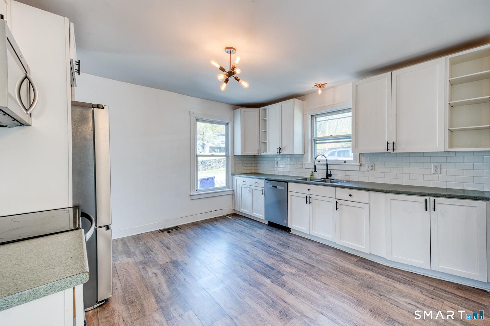 84 Jackson Street Torrington, CT 06790 - Photo 7 of 40 Remodeled kitchen with stainless steel appliances.