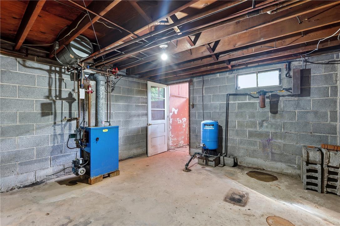 1033 Walt Road Pennsburg, PA 18073 - Photo 32 of 40 Exposed ceiling joists and concrete block walls define this functional utility space.
