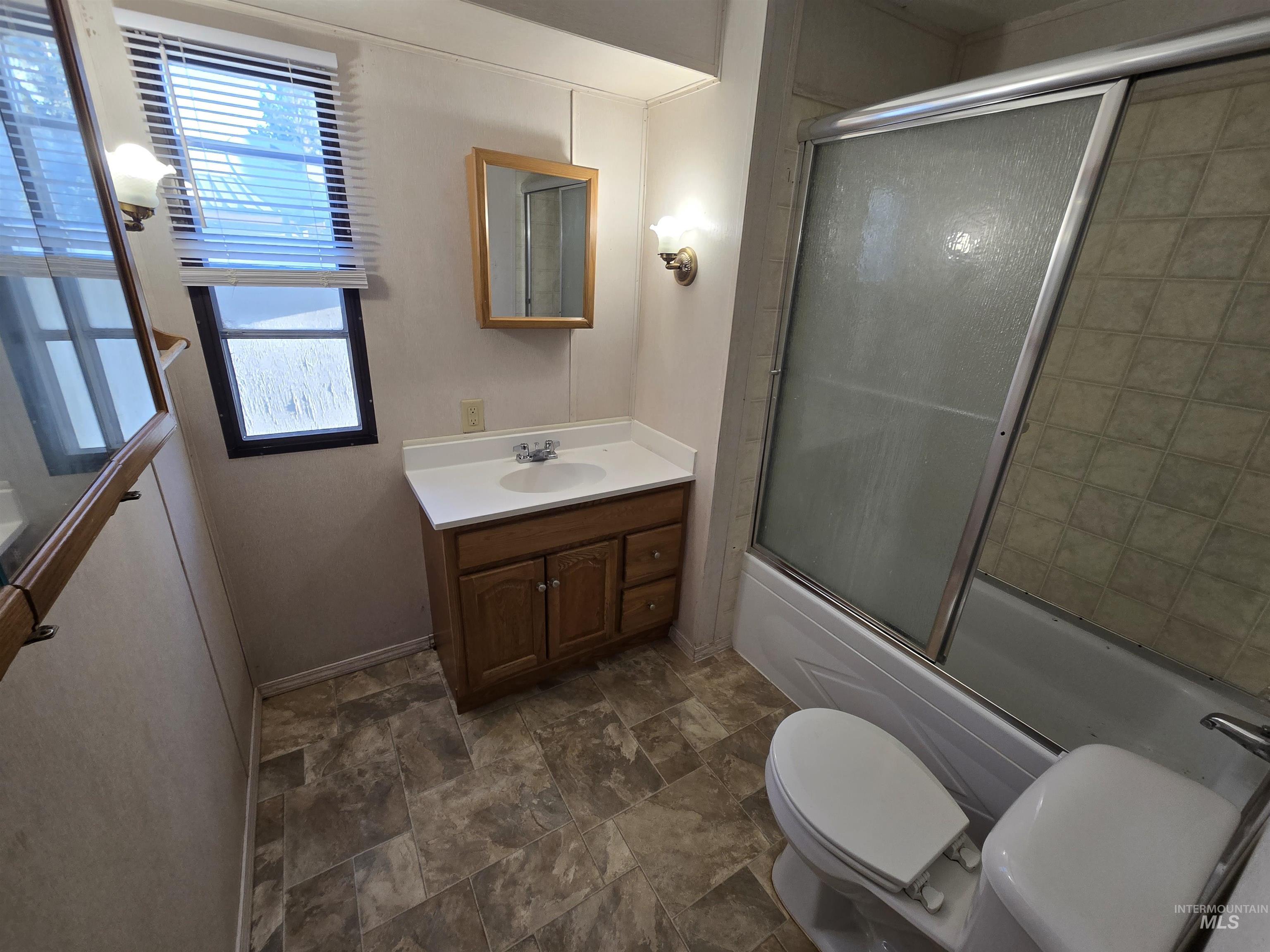 198 South Hills Road, Unit 148 Twin Falls, ID 83301 - Photo 14 of 18 Wood-finish vanity with an integrated sink and countertop