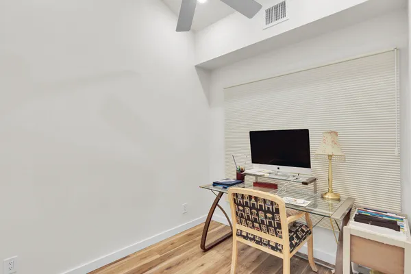 a view of a workspace with furniture