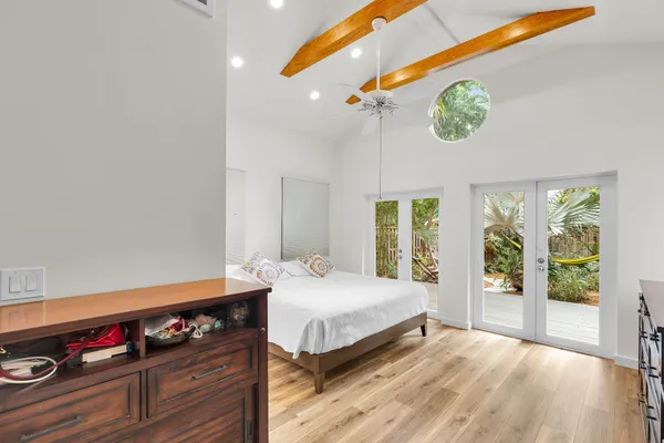 a bedroom with a bed and a dresser