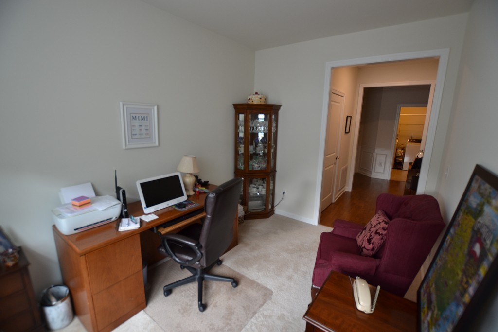7 Augustus Court, Unit 1013 Reading, MA 01867 - Photo 11 of 34 a view of a workspace with furniture and bedroom