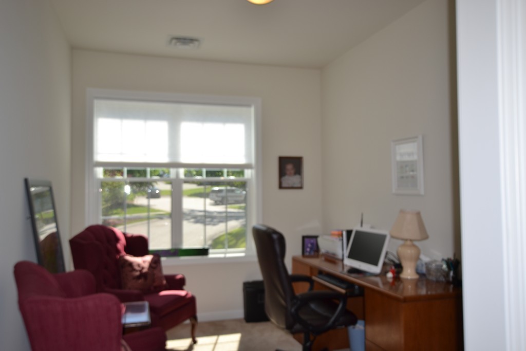 7 Augustus Court, Unit 1013 Reading, MA 01867 - Photo 12 of 34 a work room with furniture and large windows