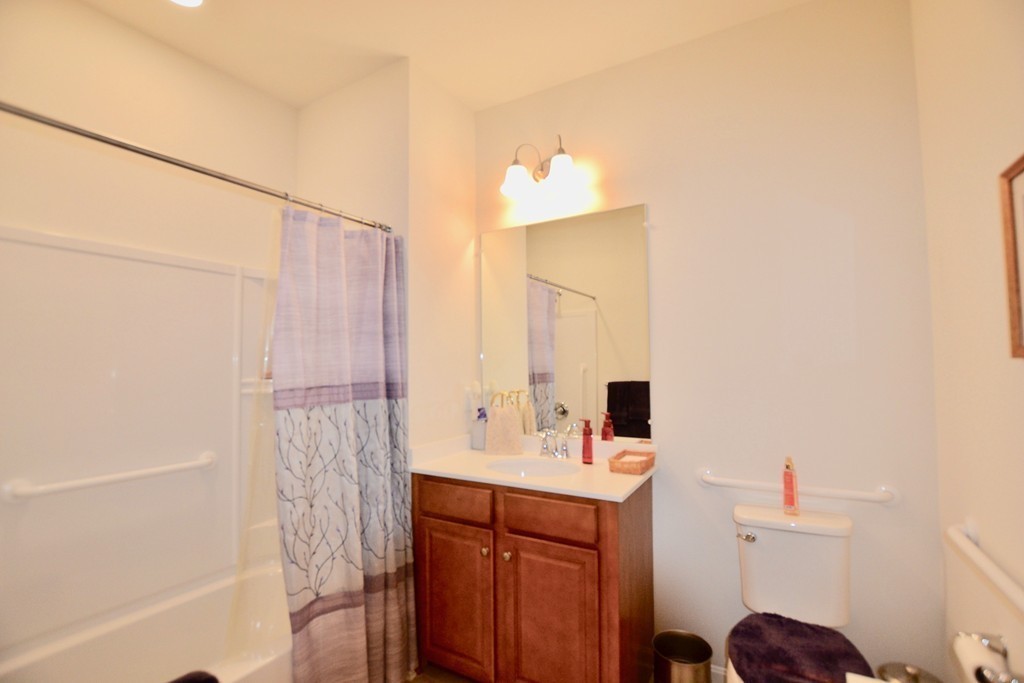 7 Augustus Court, Unit 1013 Reading, MA 01867 - Photo 26 of 34 a bathroom with a sink and a mirror