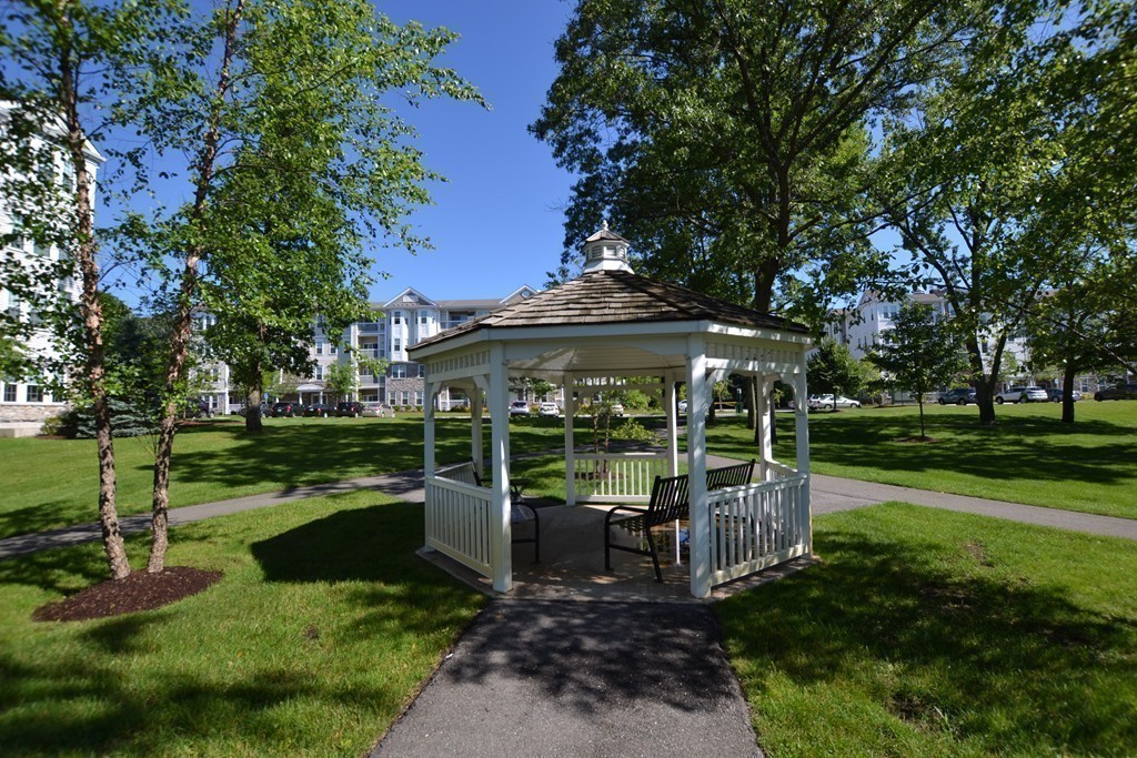 7 Augustus Court, Unit 1013 Reading, MA 01867 - Photo 28 of 34 an outdoor view of a garden