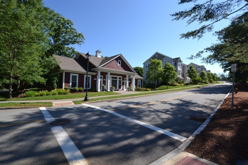 7 Augustus Court, Unit 1013 Reading, MA 01867 - Photo 30 of 34 a front view of a house with a yard