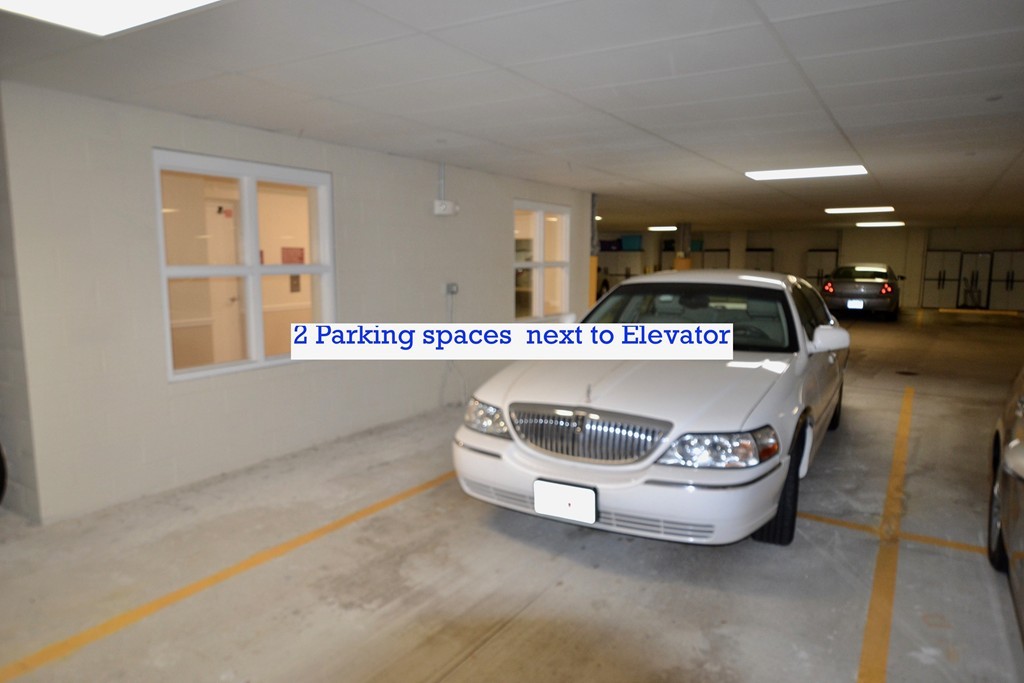 7 Augustus Court, Unit 1013 Reading, MA 01867 - Photo 33 of 34 a room with a table and chairs