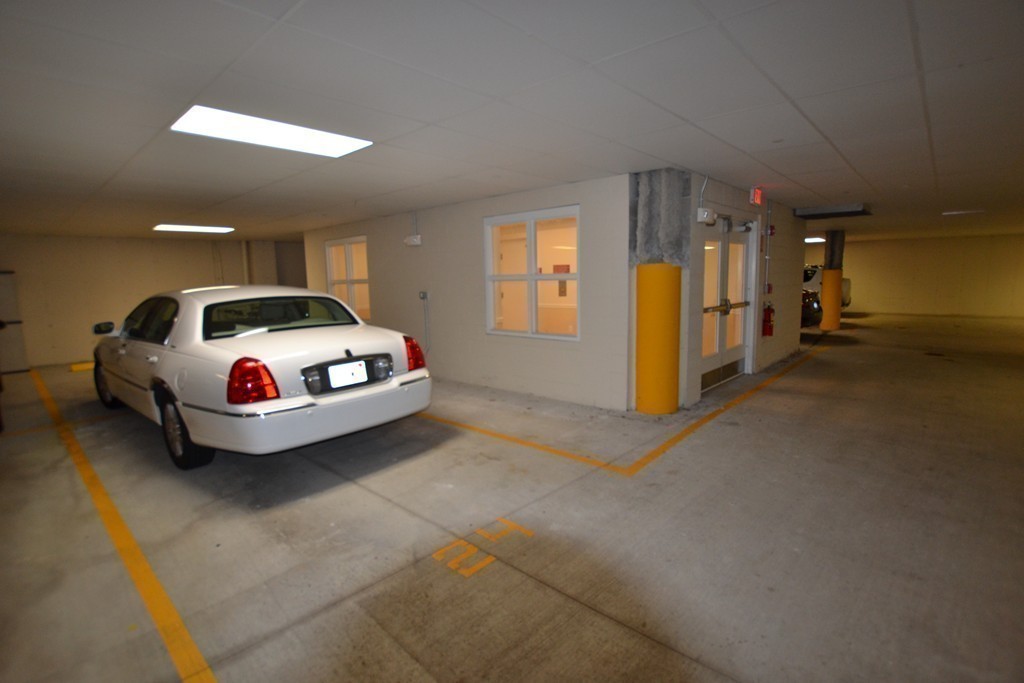 7 Augustus Court, Unit 1013 Reading, MA 01867 - Photo 34 of 34 a car parked in garage
