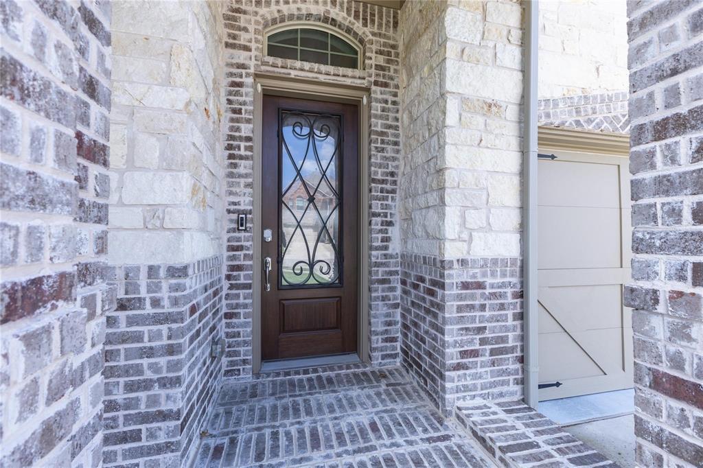 3920 Bentgrass Road Plano, TX 75023 - Photo 4 of 30 a front view of a house with an entrance