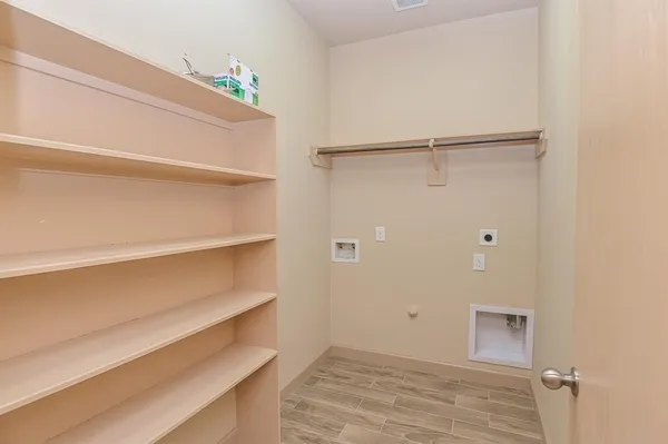 a view of an empty walk in closet