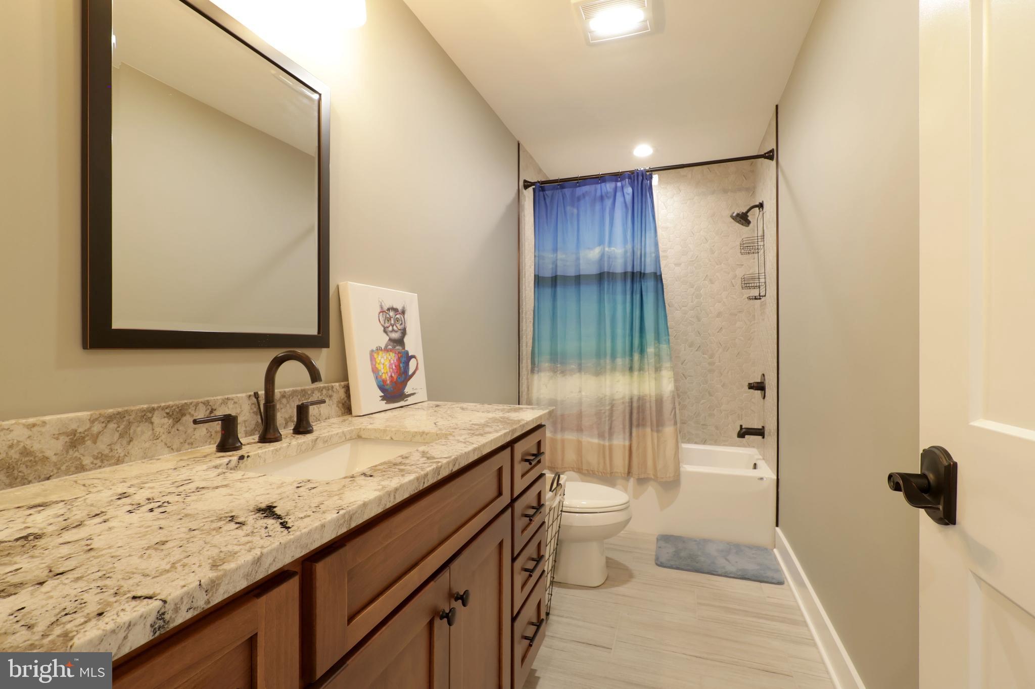 518 Two Mile Road Howard, PA 16841 - Photo 44 of 84 a bathroom with a granite countertop sink toilet and shower