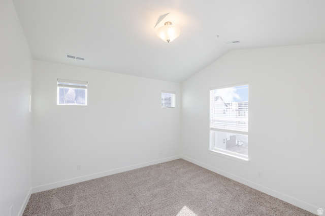 4662 Poplar Way, Unit Q302 Mapleton, UT 84664 - Photo 6 of 17 Unfurnished room with lofted ceiling and carpet