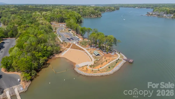 an aerial view of a house with a lake view