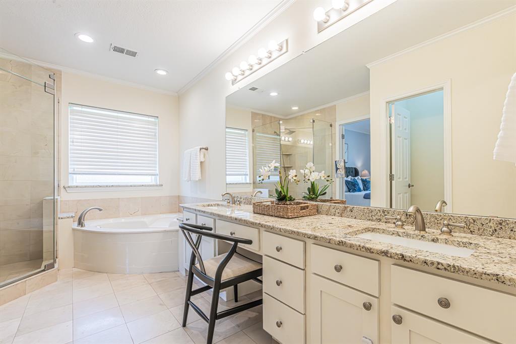 300 Sundance Circle Irving, TX 75063 - Photo 14 of 39 Dual vanity with granite countertops, undermount sinks, and brushed nickel fixtures