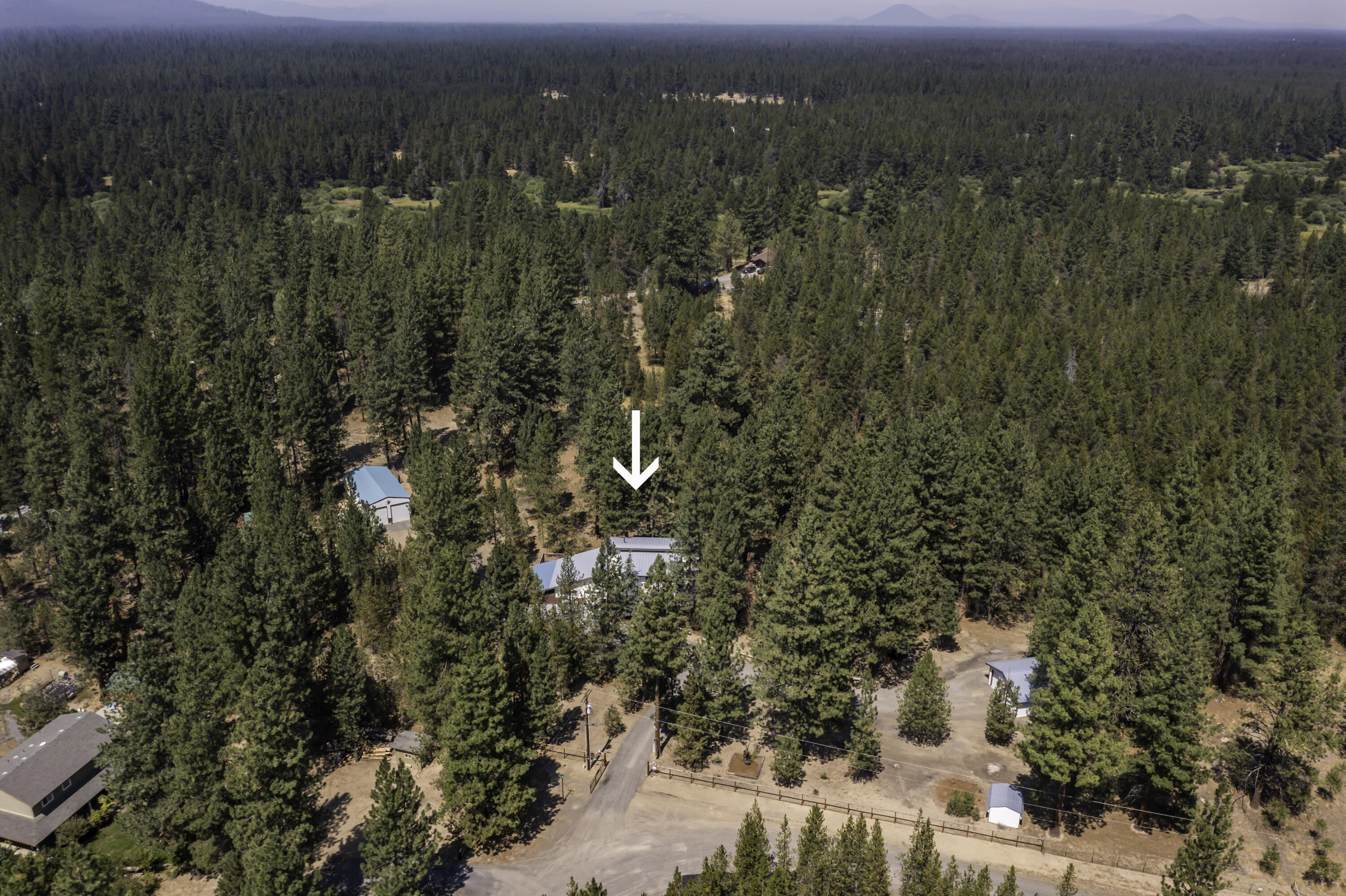 15730 Jackpine Road La Pine, OR 97739 - Photo 3 of 43 a view of a city with lush green forest