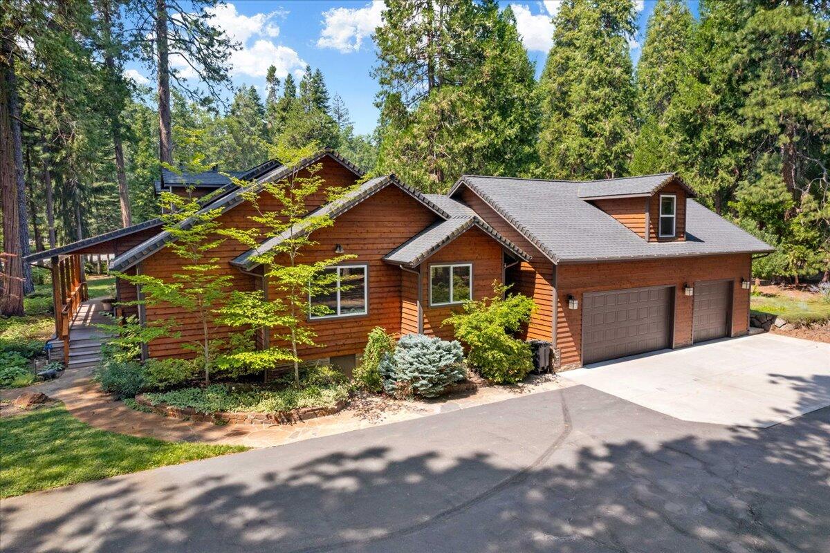 1601 Timber Hills Road Mount Shasta, CA 96067 - Photo 13 of 74 a front view of a house with a yard and trees