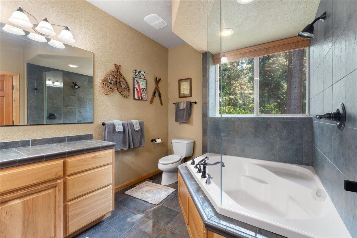 1601 Timber Hills Road Mount Shasta, CA 96067 - Photo 23 of 74 a bathroom with a tub sink and mirror