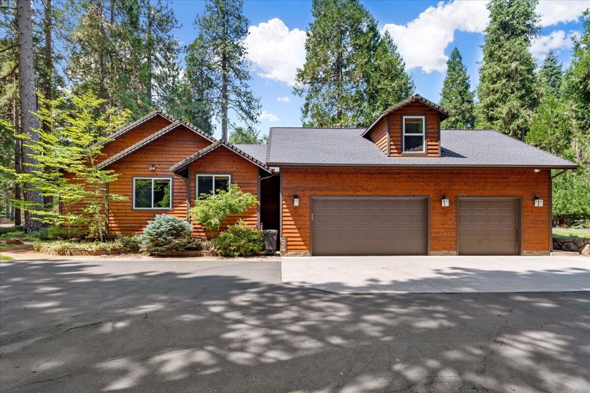 1601 Timber Hills Road Mount Shasta, CA 96067 - Photo 69 of 74 a front view of a house with a garden