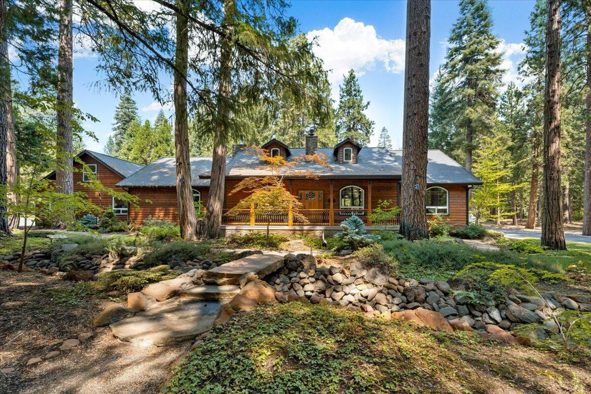 1601 Timber Hills Road Mount Shasta, CA 96067 - Photo 72 of 74 a view of a house with a yard and large trees