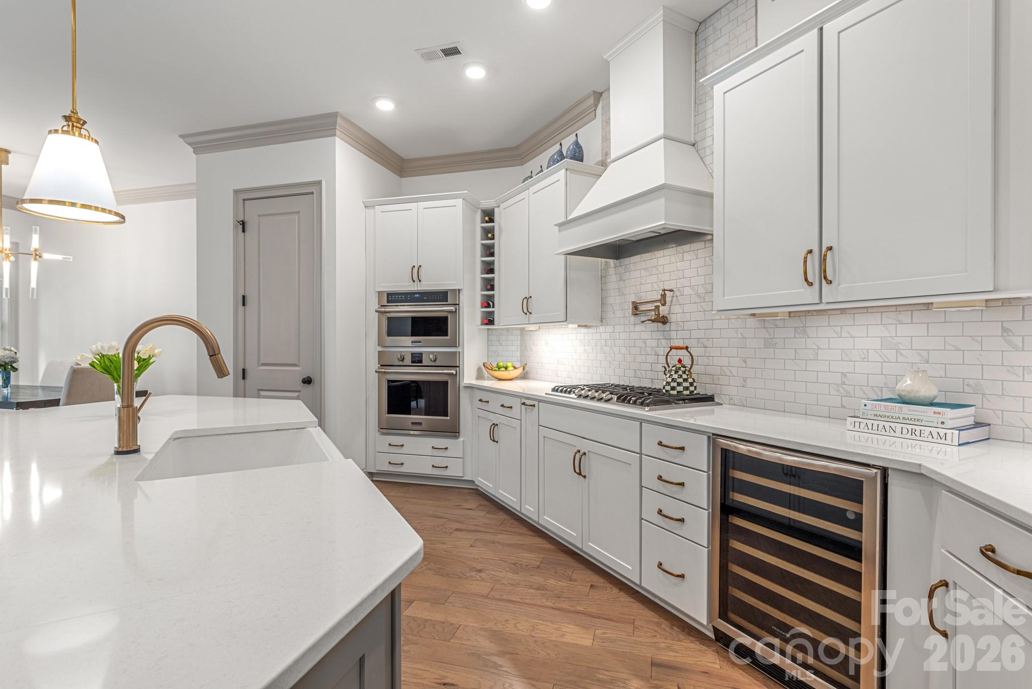 2547 Barry Street Charlotte, NC 28205 - Photo 15 of 45 a kitchen with stainless steel appliances granite countertop a sink dishwasher a stove and a refrigerator