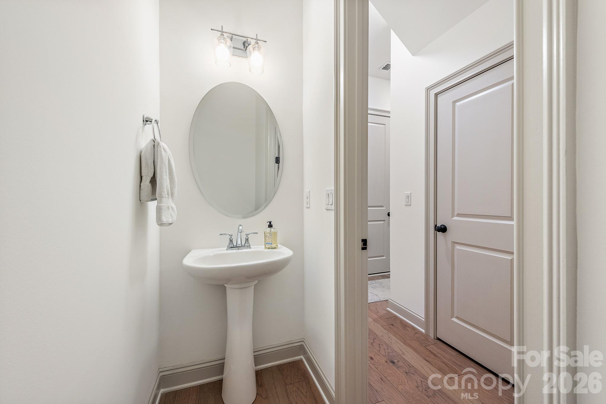2547 Barry Street Charlotte, NC 28205 - Photo 25 of 45 a bathroom with a sink and a mirror