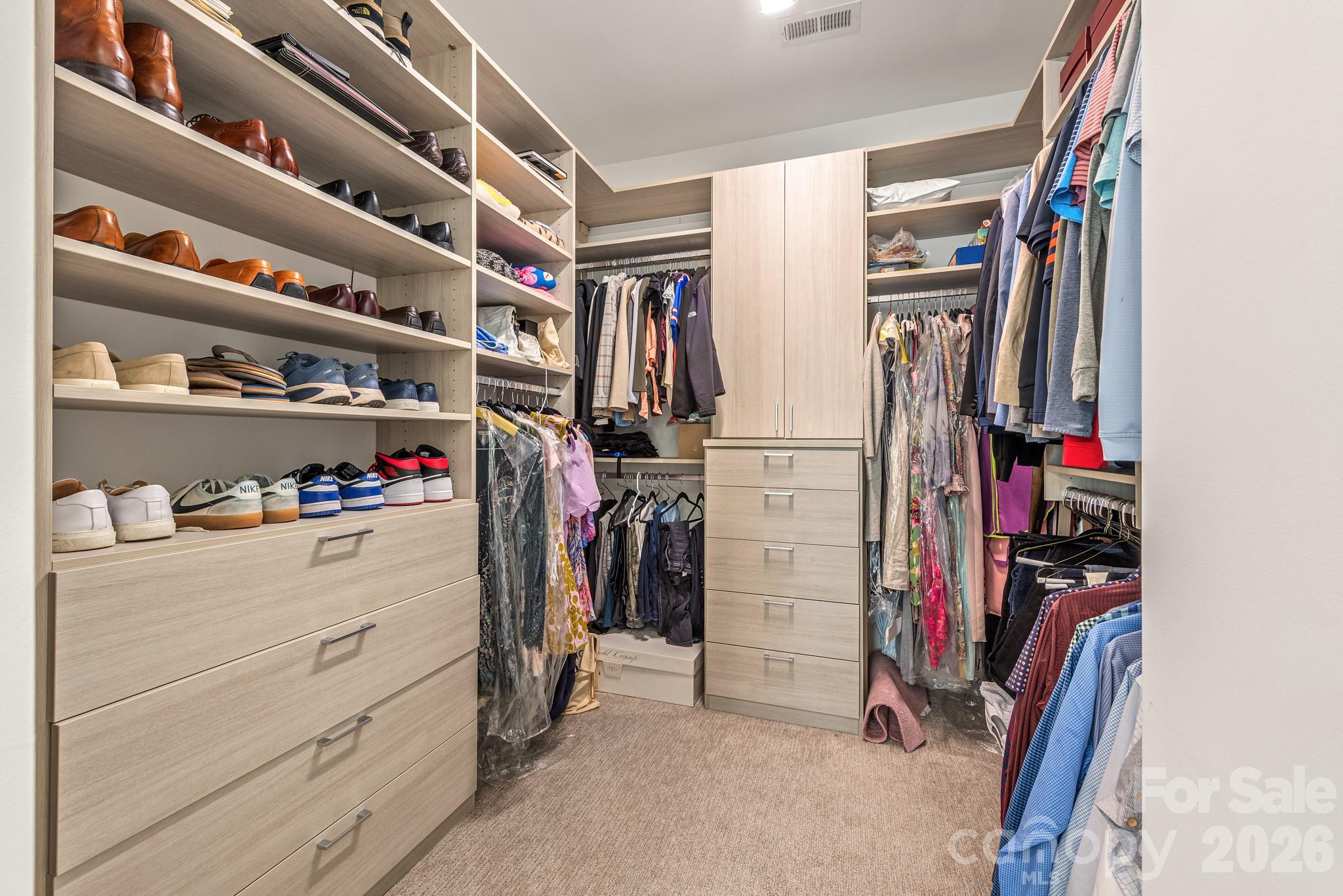2547 Barry Street Charlotte, NC 28205 - Photo 30 of 45 a view of walk in closet with clothes and shoes