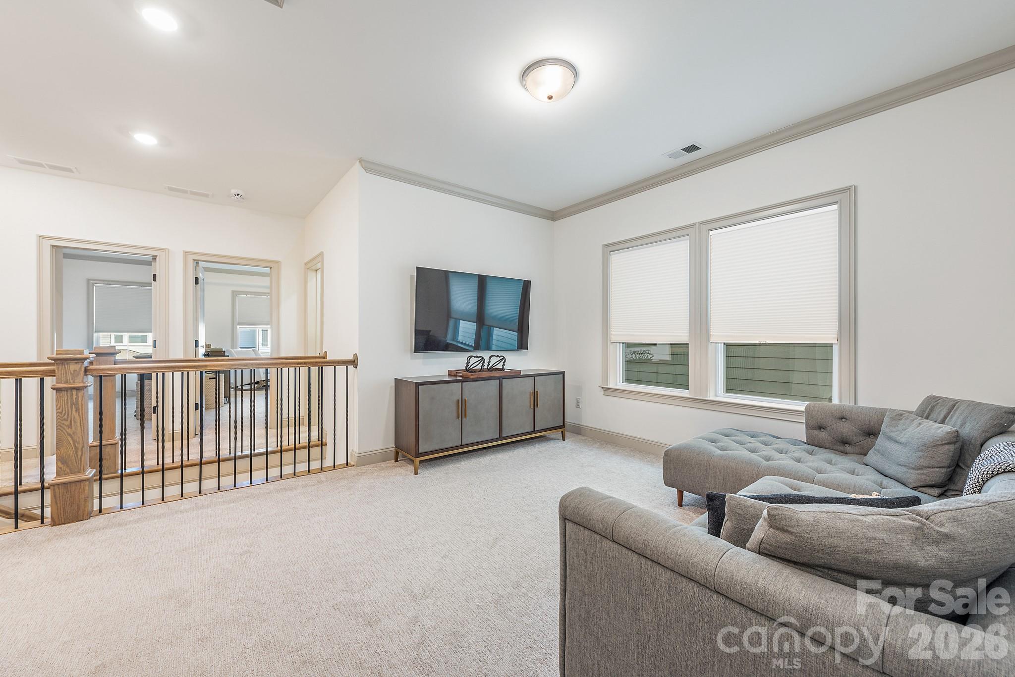 2547 Barry Street Charlotte, NC 28205 - Photo 34 of 45 a living room with furniture and a flat screen tv