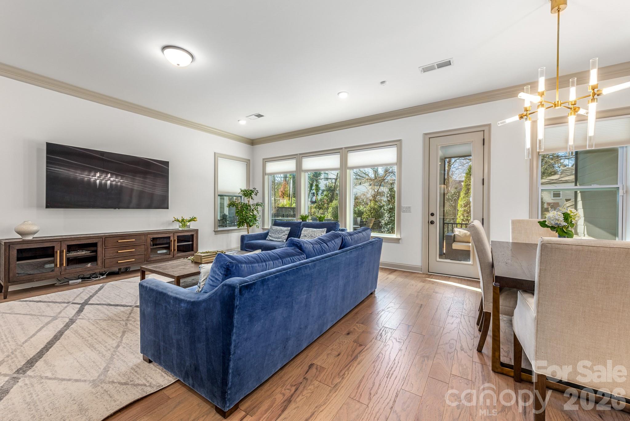2547 Barry Street Charlotte, NC 28205 - Photo 8 of 45 a living room with furniture and a flat screen tv