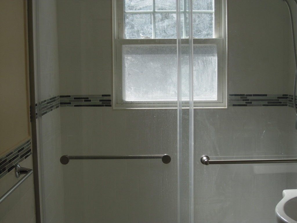 139 Readville Street Boston, MA 02136 - Photo 19 of 31 a bathroom with a window