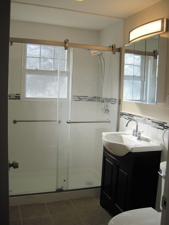 139 Readville Street Boston, MA 02136 - Photo 20 of 31 a bathroom with a sink and mirror