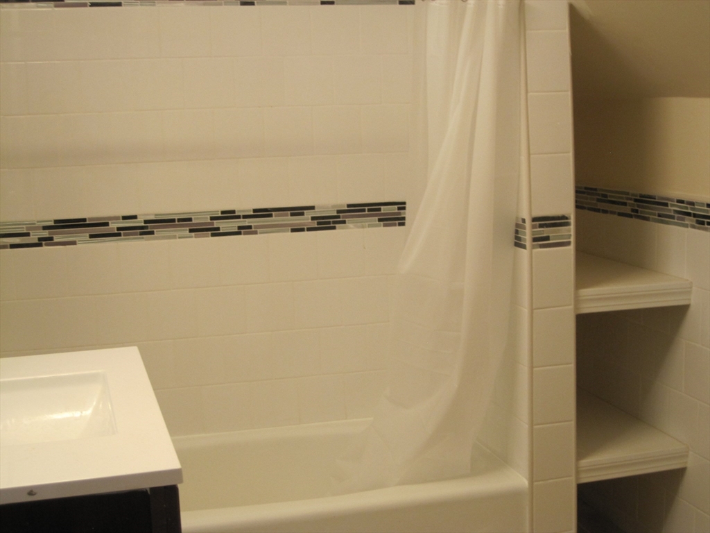 139 Readville Street Boston, MA 02136 - Photo 22 of 31 a bathroom with a sink and a shower