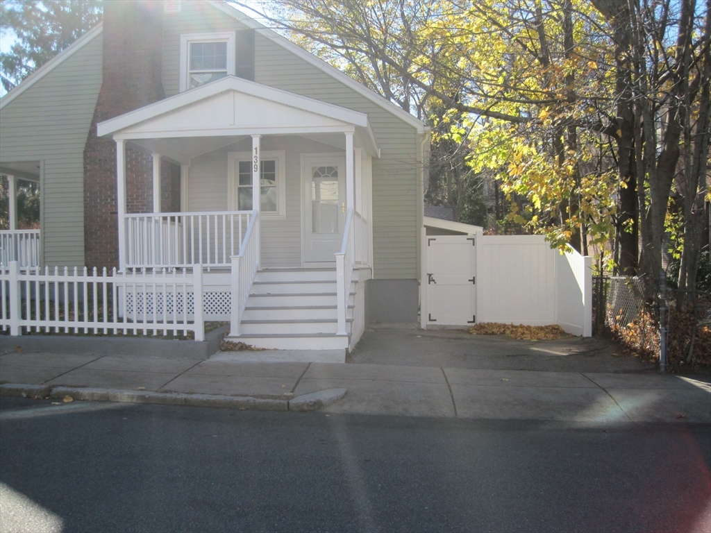 139 Readville Street Boston, MA 02136 - Photo 29 of 31 a front view of a house with a garage