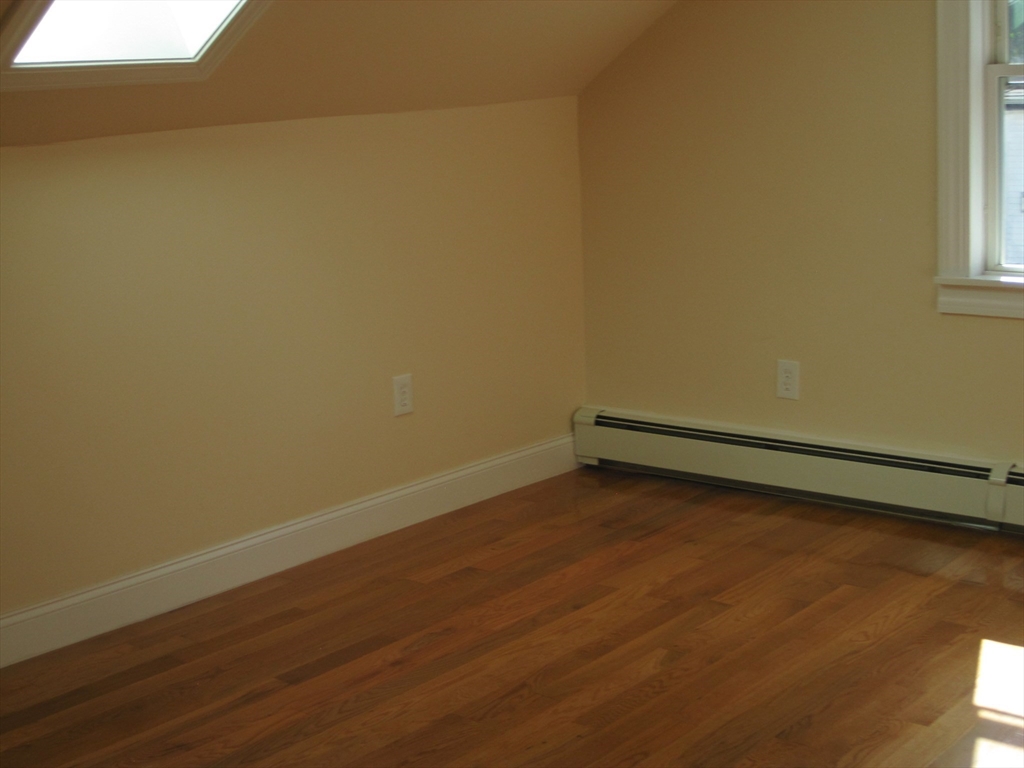 139 Readville Street Boston, MA 02136 - Photo 10 of 31 a view of a room with wooden floor and fence