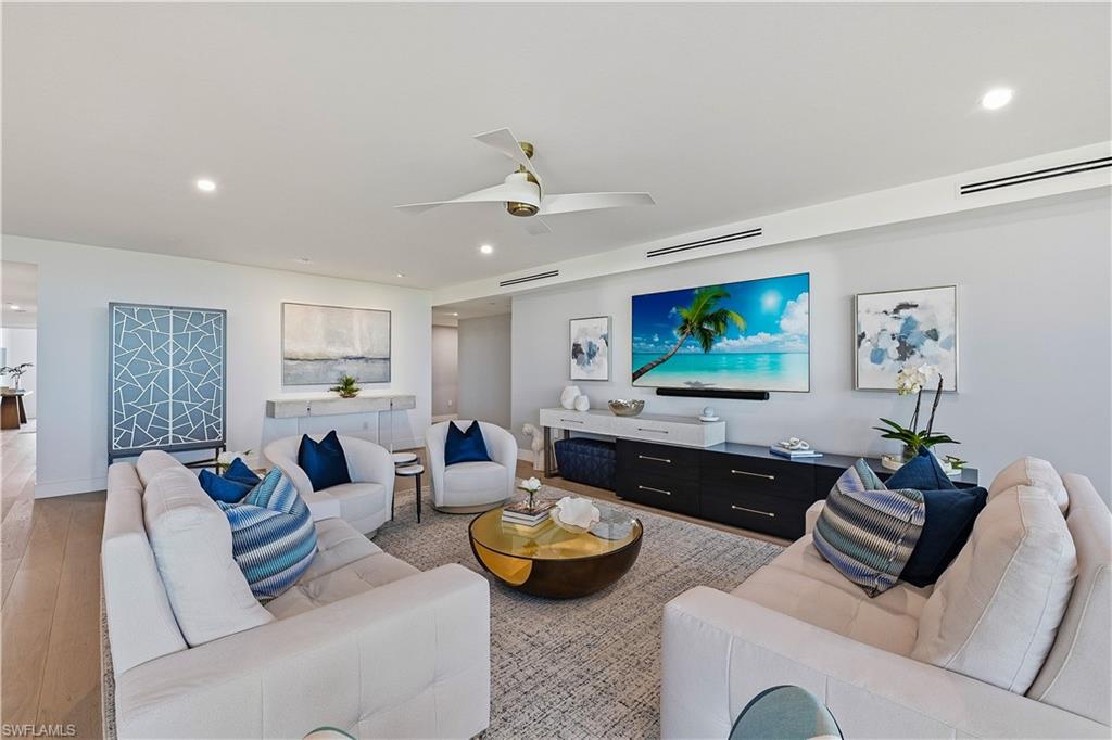 13935 Old Coast Road, Unit 406 Naples, FL 34110 - Photo 11 of 49 Living area with ceiling fan, wood finished floors, and recessed lighting