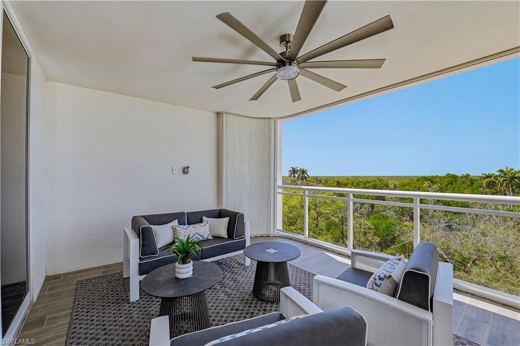 13935 Old Coast Road, Unit 406 Naples, FL 34110 - Photo 29 of 49 Patio / terrace with a ceiling fan and an outdoor lounge area