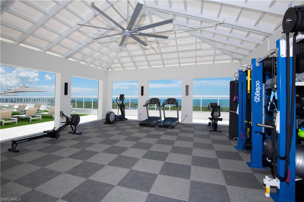 13935 Old Coast Road, Unit 406 Naples, FL 34110 - Photo 35 of 49 Exercise room featuring a high ceiling, a water view, and a ceiling fan
