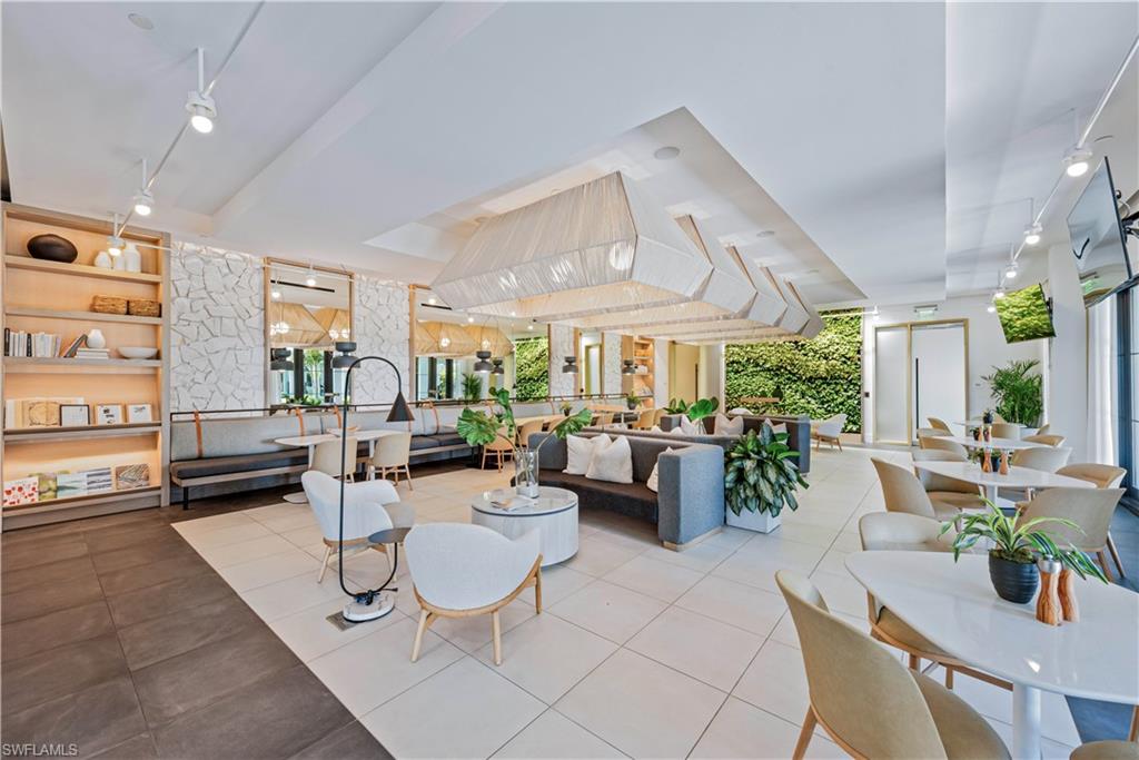 13935 Old Coast Road, Unit 406 Naples, FL 34110 - Photo 42 of 49 Community lobby featuring rail lighting