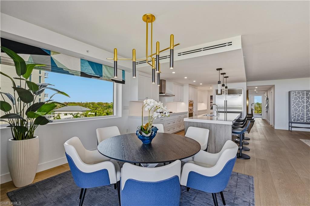 13935 Old Coast Road, Unit 406 Naples, FL 34110 - Photo 6 of 49 Dining area featuring light wood-style floors and recessed lighting