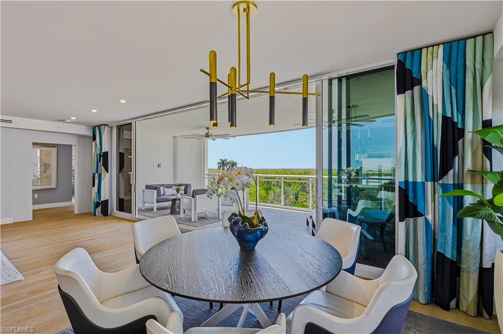 13935 Old Coast Road, Unit 406 Naples, FL 34110 - Photo 7 of 49 Dining space featuring light wood finished floors, a ceiling fan, and recessed lighting