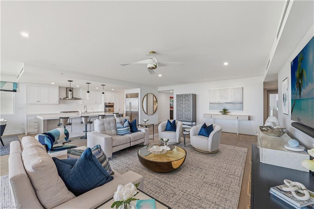 13935 Old Coast Road, Unit 406 Naples, FL 34110 - Photo 8 of 49 Living area with ceiling fan, wood finished floors, and recessed lighting