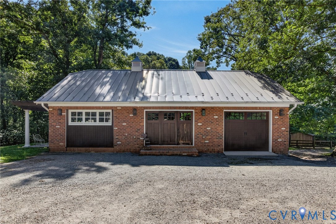1108 Shallow Well Road Manakin-Sabot, VA 23103 - Photo 83 of 86 Brick exterior with a metal roof, featuring a two-