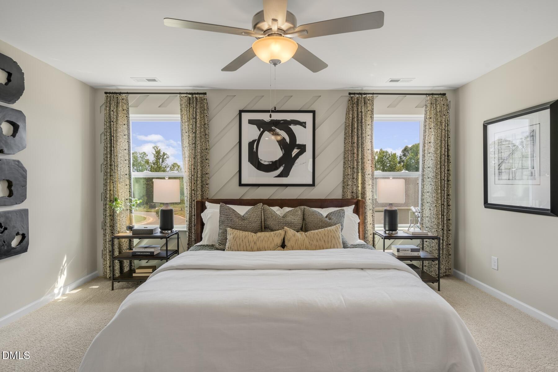 128 Lennei Lane Garner, NC 27529 - Photo 25 of 30 a bedroom with a bed and a chandelier