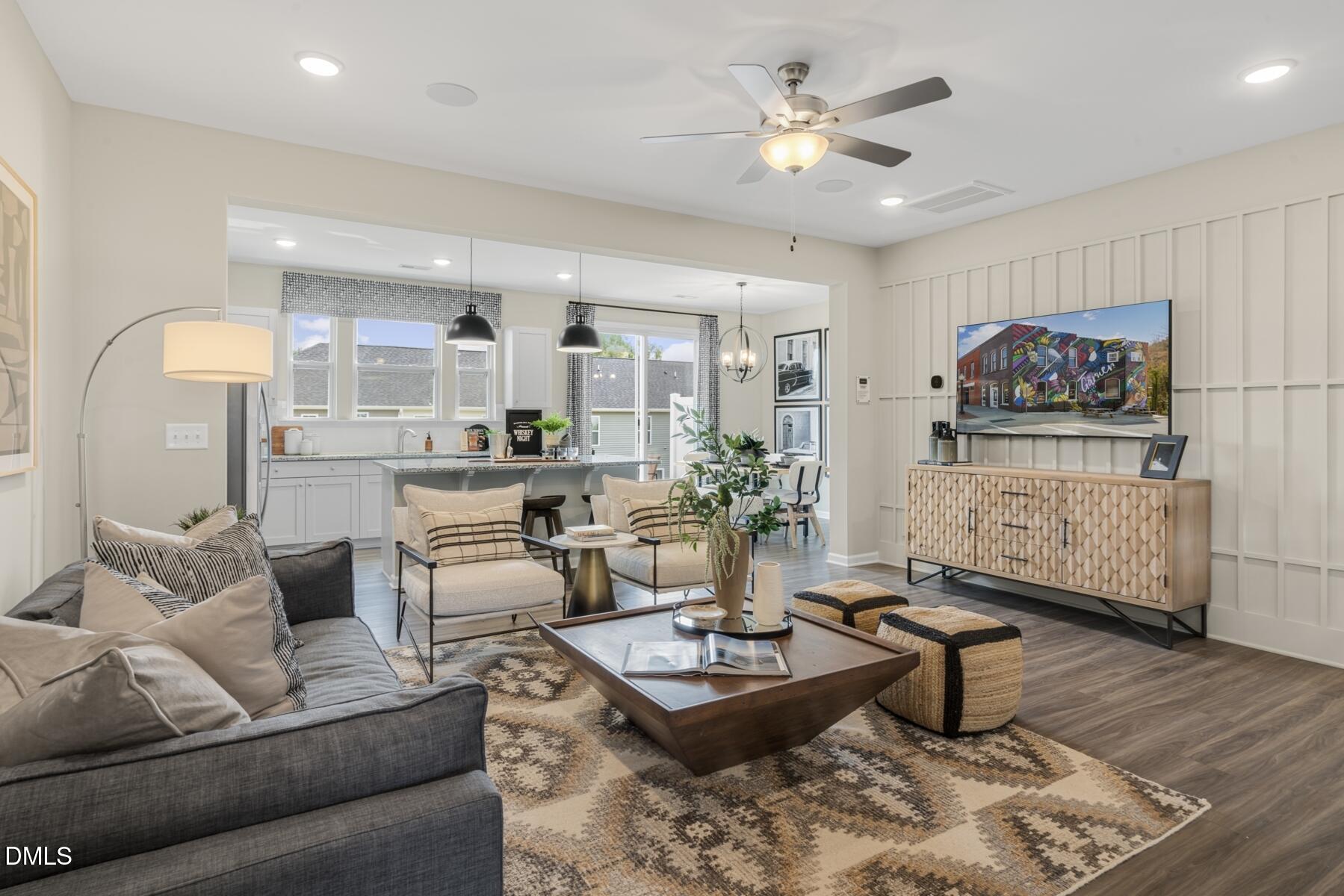 128 Lennei Lane Garner, NC 27529 - Photo 3 of 30 a living room with furniture and a chandelier
