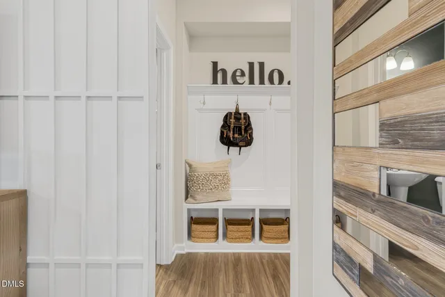 a view of an entryway with wooden floor