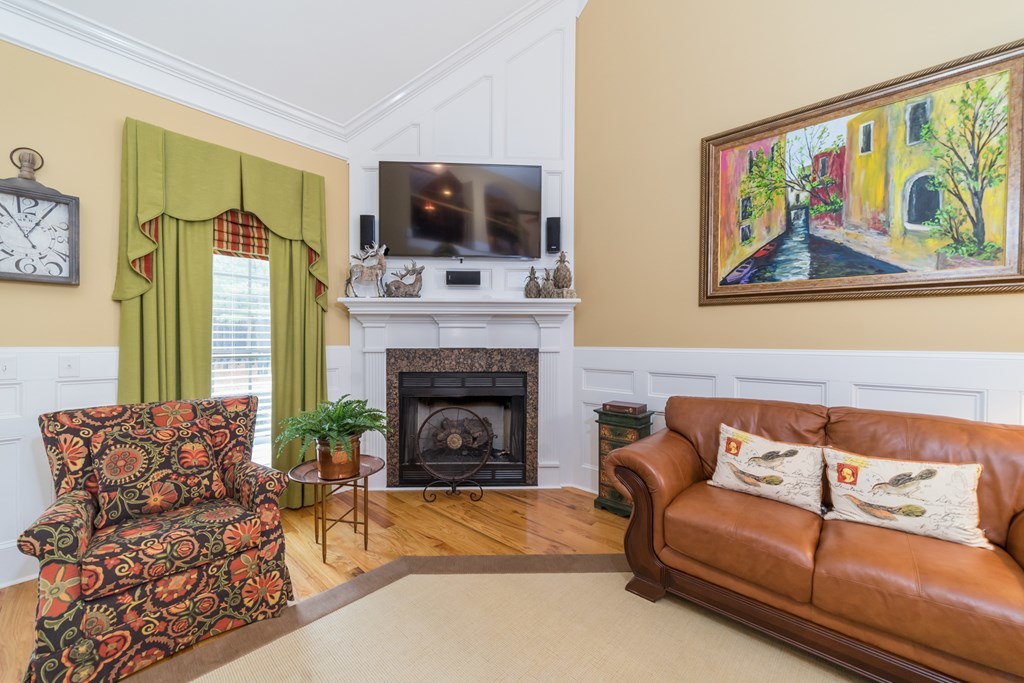2045 Midway Road Lizella, GA 31052 - Photo 8 of 66 a living room with furniture fireplace and flat screen tv