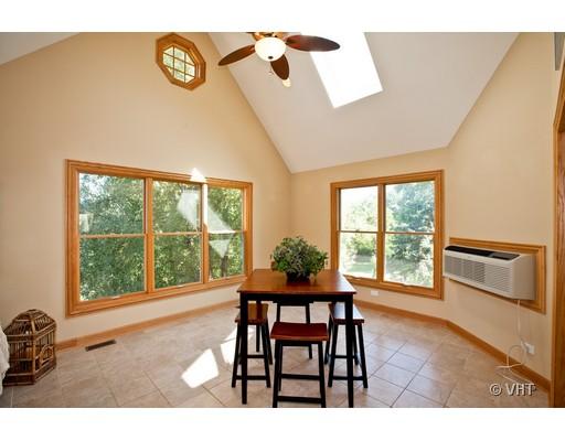 15W752 83rd Street Burr Ridge, IL 60527 - Photo 13 of 16 a dining room with furniture and a window