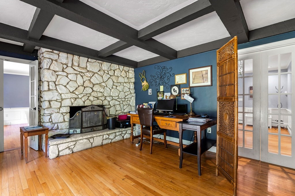 10 Beaver Pond Road Beverly, MA 01915 - Photo 17 of 39 a living room with furniture a fireplace and a flat screen tv