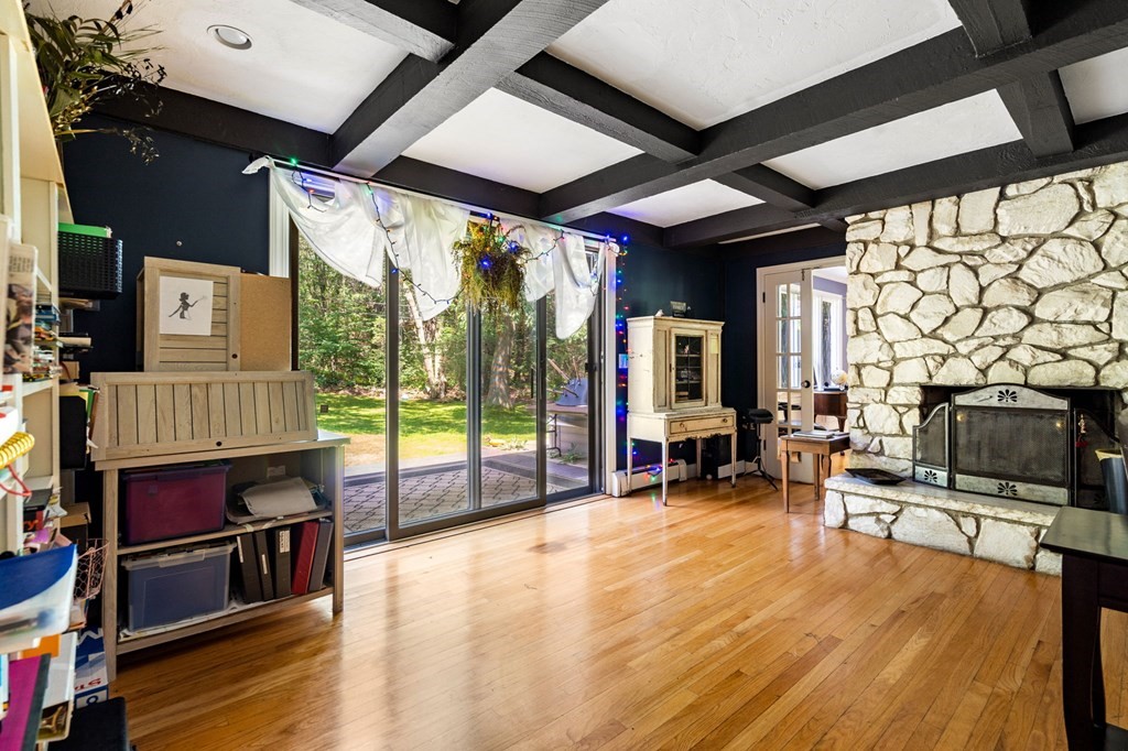 10 Beaver Pond Road Beverly, MA 01915 - Photo 18 of 39 a living room filled with furniture and a fireplace